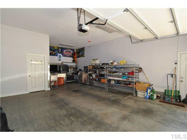4209 White Chapel Way Raleigh, NC 27615 - Photo 3 of 25 The detached garage offers plenty of space for work shop area, storage, 2 cars or other recreational vehicles.