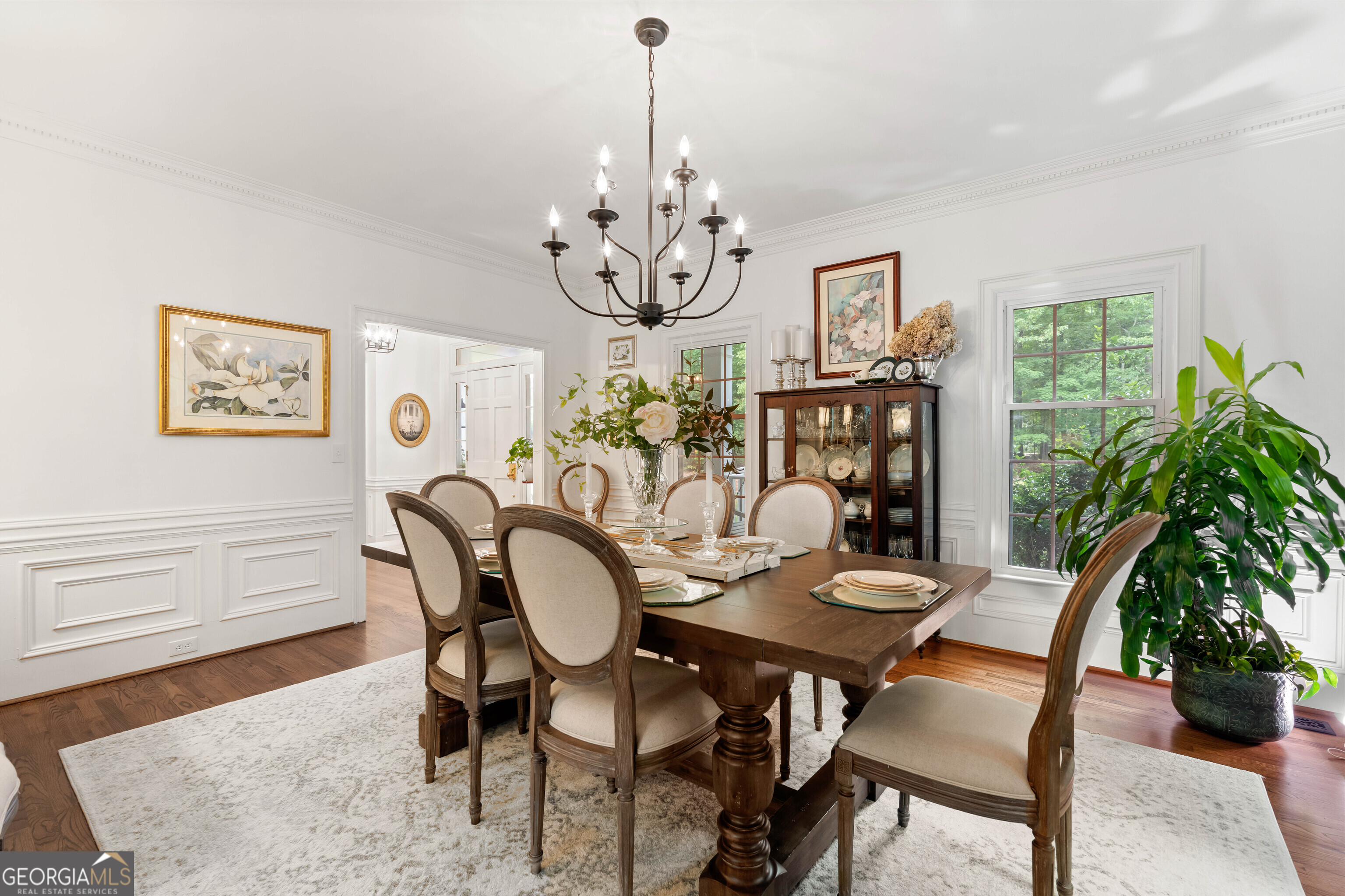 836 Oak Grove Road Carrollton, GA 30117 - Photo 26 of 50 a dining room with furniture potted plants and wooden floor
