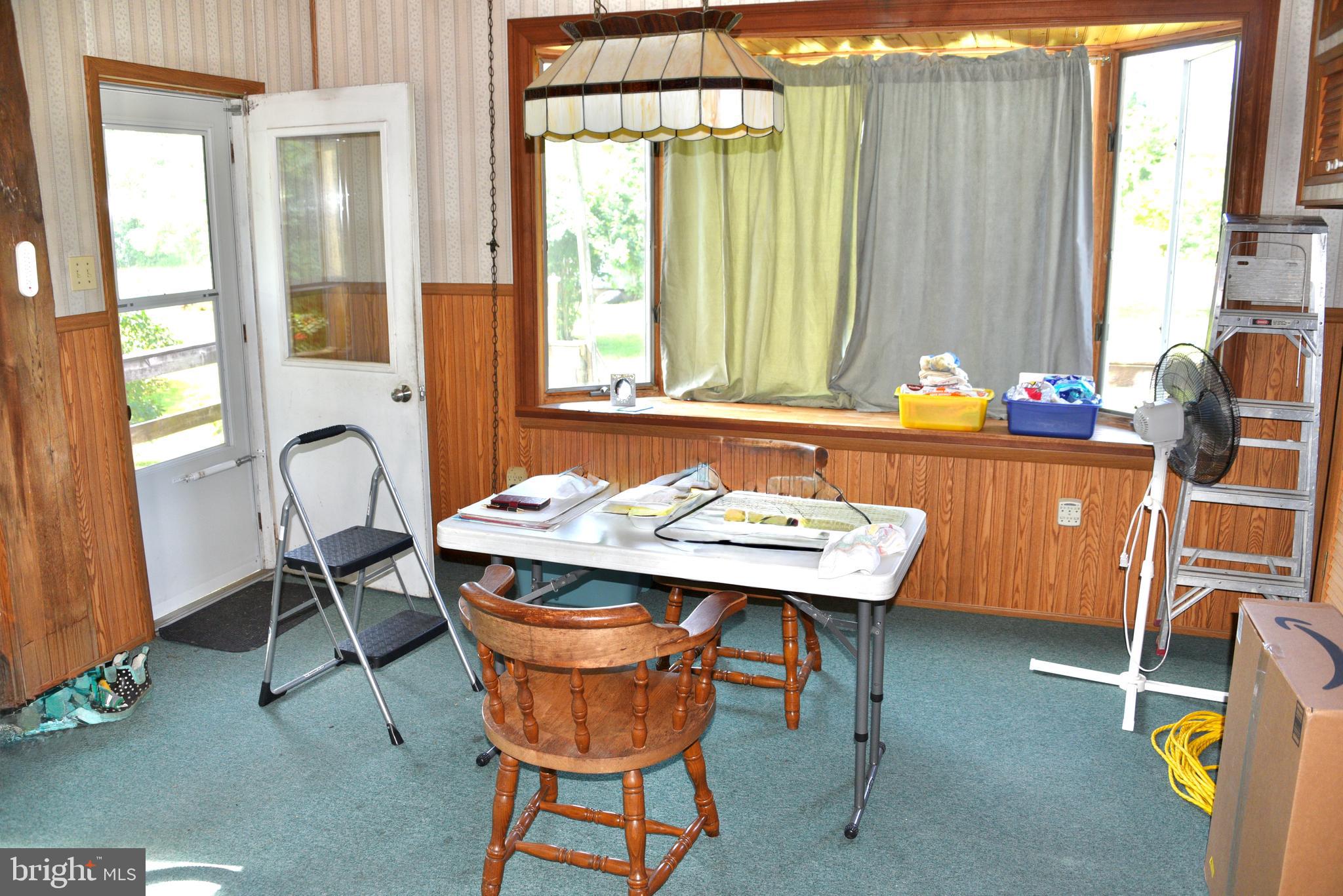 722 Mohns Hill Road Reading, PA 19608 - Photo 11 of 46 a dining room with a window and chairs