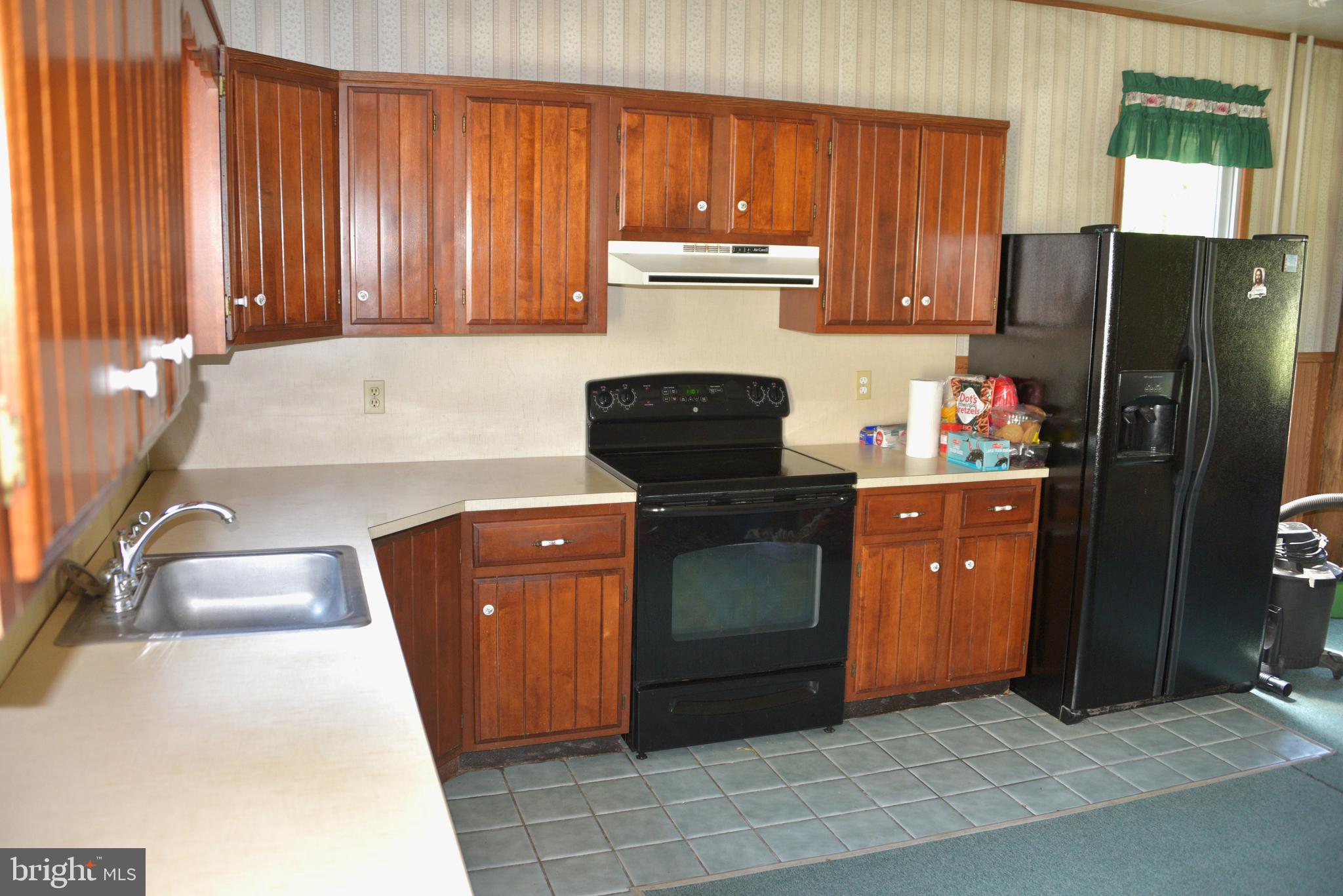 722 Mohns Hill Road Reading, PA 19608 - Photo 10 of 46 a kitchen with stainless steel appliances granite countertop a refrigerator a stove a sink and dishwasher