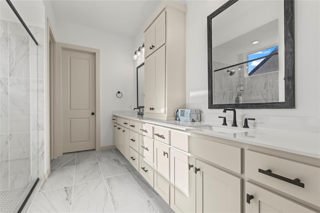 15627 Rue Drive Frisco, TX 75033 - Photo 20 of 35 a spacious bathroom with double sink and a mirror