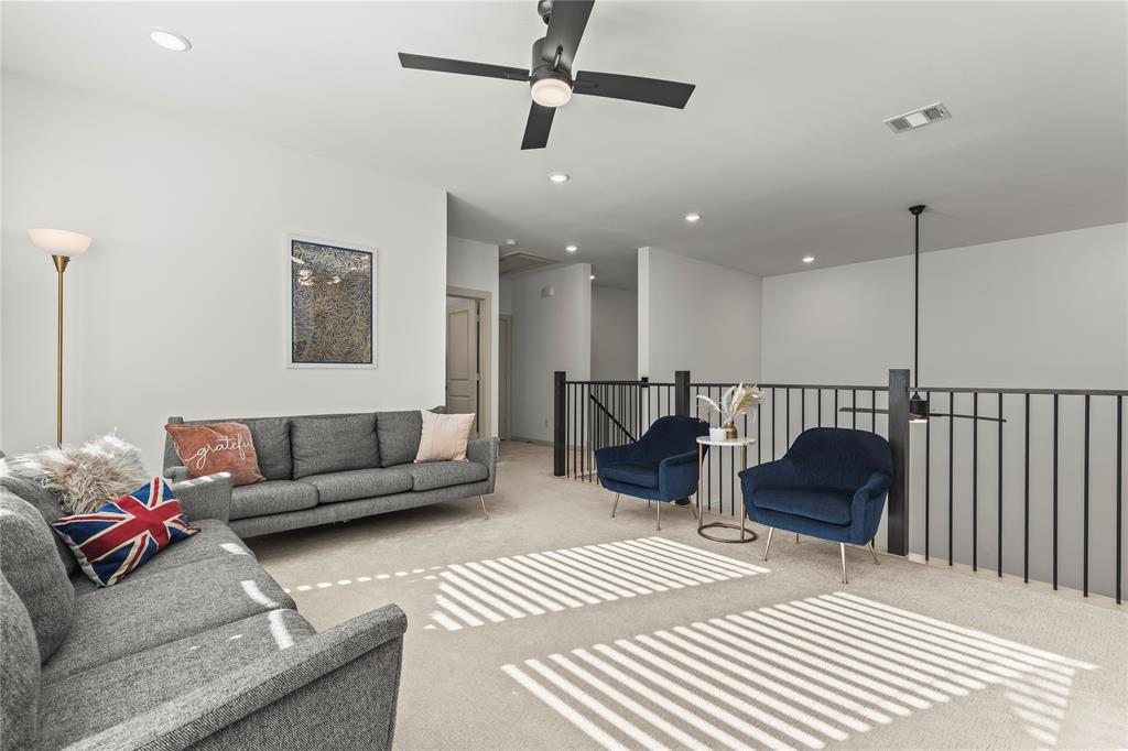 15627 Rue Drive Frisco, TX 75033 - Photo 28 of 35 a living room with furniture and a ceiling fan