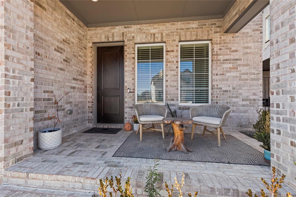 15627 Rue Drive Frisco, TX 75033 - Photo 3 of 35 a view of a patio with table and chairs