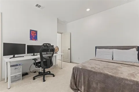 a bedroom with a workspace