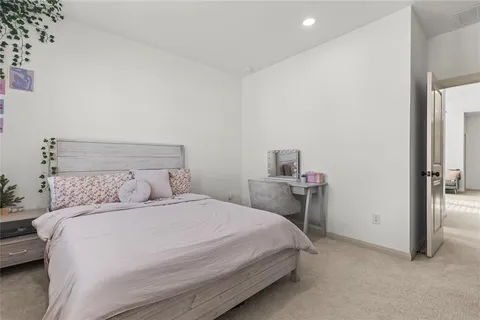 a bedroom with a bed and a table