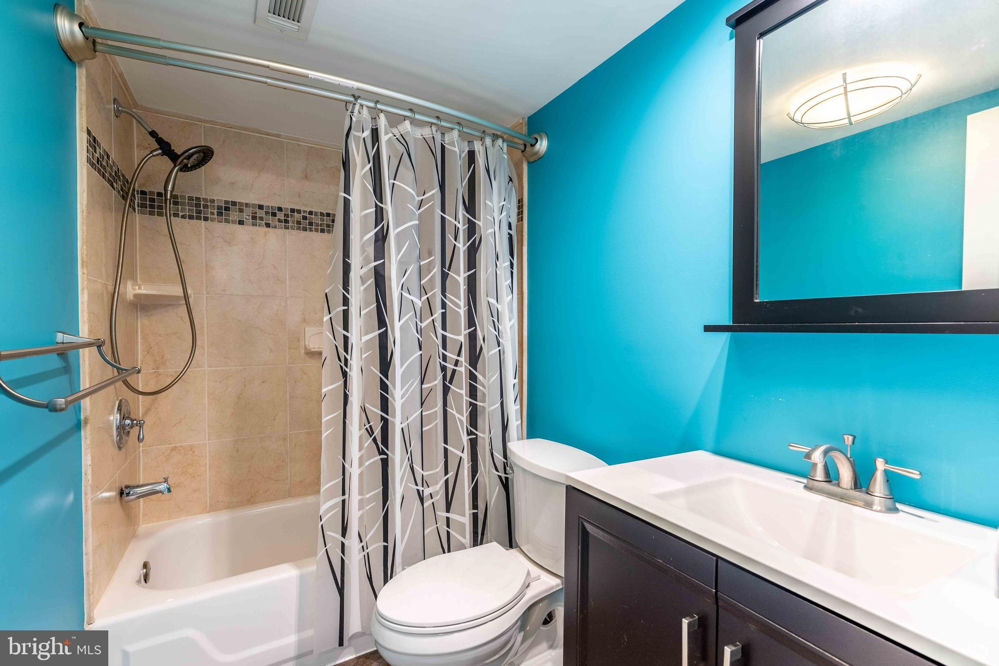 704 Painters Crossing, Unit 704 Chadds Ford, PA 19317 - Photo 16 of 34 a bathroom with a sink a toilet and a bathtub