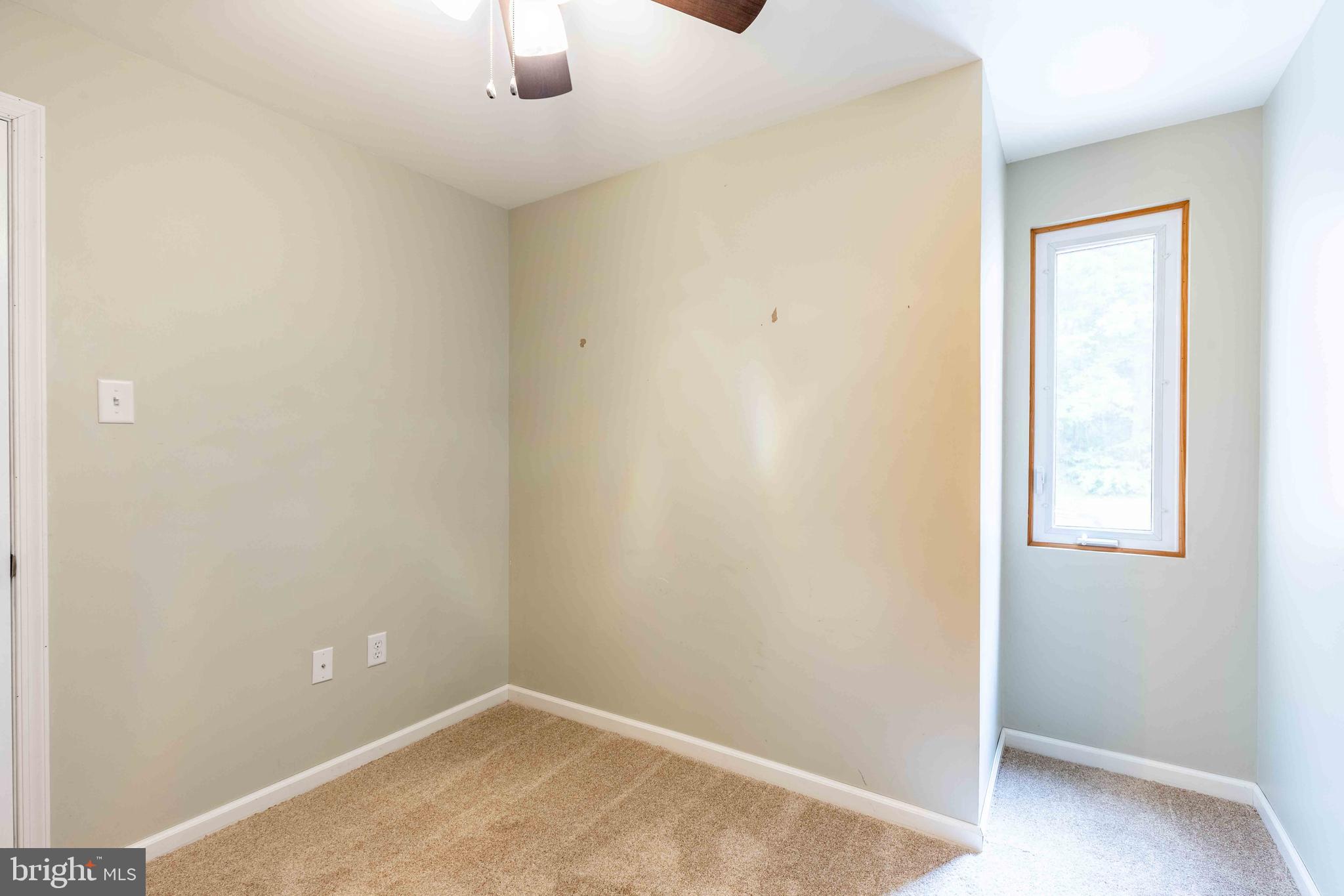 704 Painters Crossing, Unit 704 Chadds Ford, PA 19317 - Photo 20 of 34 an empty room with windows