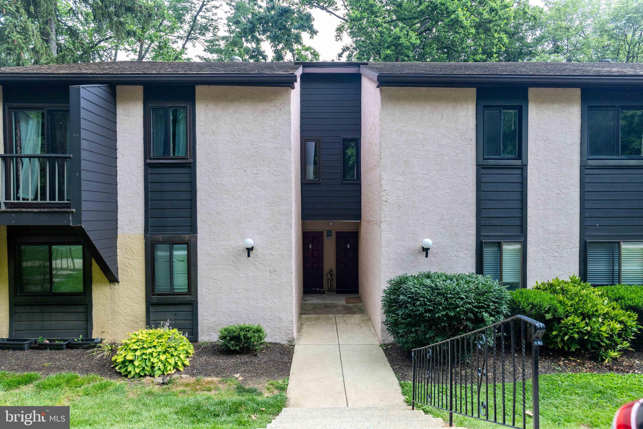 704 Painters Crossing, Unit 704 Chadds Ford, PA 19317 - Photo 2 of 34 a house view with a garden space
