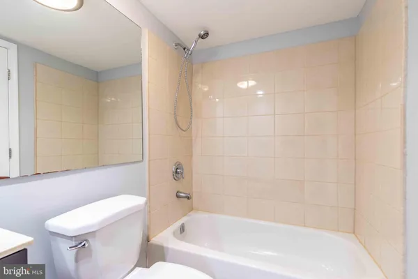a bathroom with a bathtub and a toilet