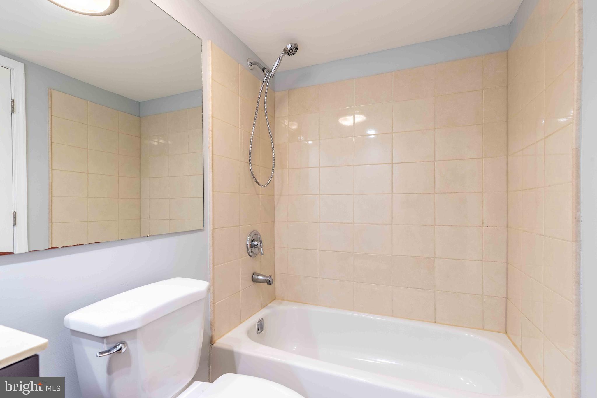 704 Painters Crossing, Unit 704 Chadds Ford, PA 19317 - Photo 23 of 34 a bathroom with a bathtub and a toilet