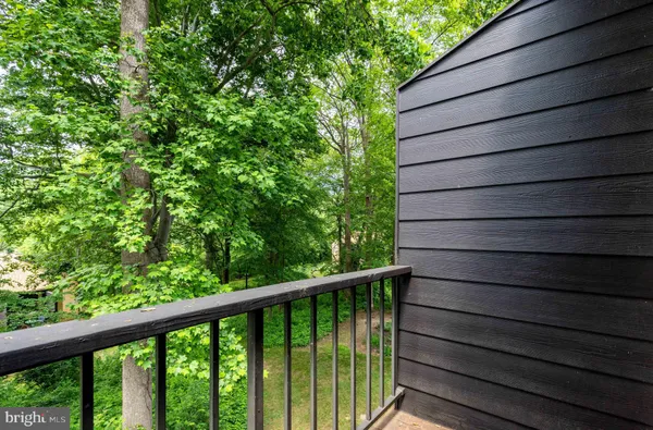 a view of a balcony with wooden floor