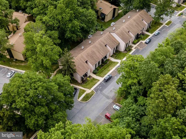 an aerial view of a house with a yard and garden
