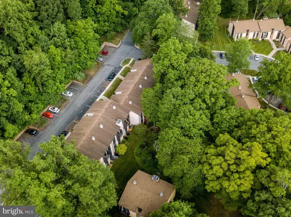 an aerial view of a house with a yard and garden