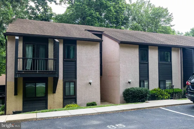 a brick house with a large windows