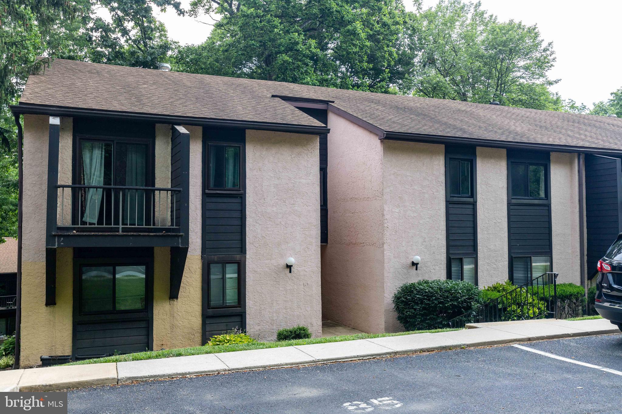704 Painters Crossing, Unit 704 Chadds Ford, PA 19317 - Photo 4 of 34 a brick house with a large windows