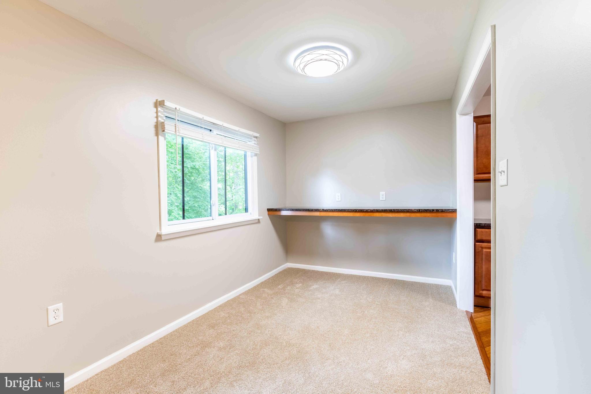 704 Painters Crossing, Unit 704 Chadds Ford, PA 19317 - Photo 8 of 34 a view of an empty room with a window