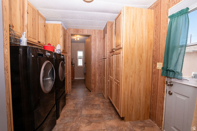 855 East 300 N Street Beaver, UT 84713 - Photo 25 of 44 Utility room featuring wood-finish wall paneling, ceiling-mounted light fixture, and wood-finish cabinetry providing ample storage