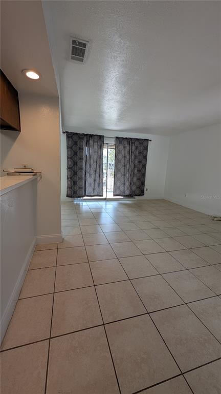 4028 Billingsgate Road Orlando, FL 32839 - Photo 4 of 8 a view of an empty room with a window
