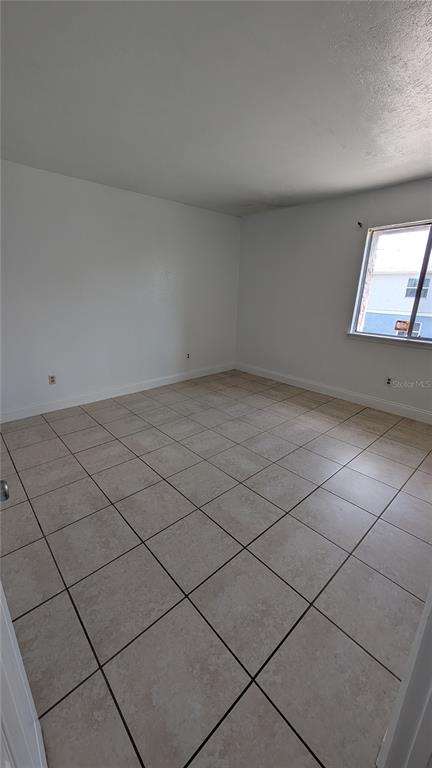 4028 Billingsgate Road Orlando, FL 32839 - Photo 6 of 8 a view of an empty room and window