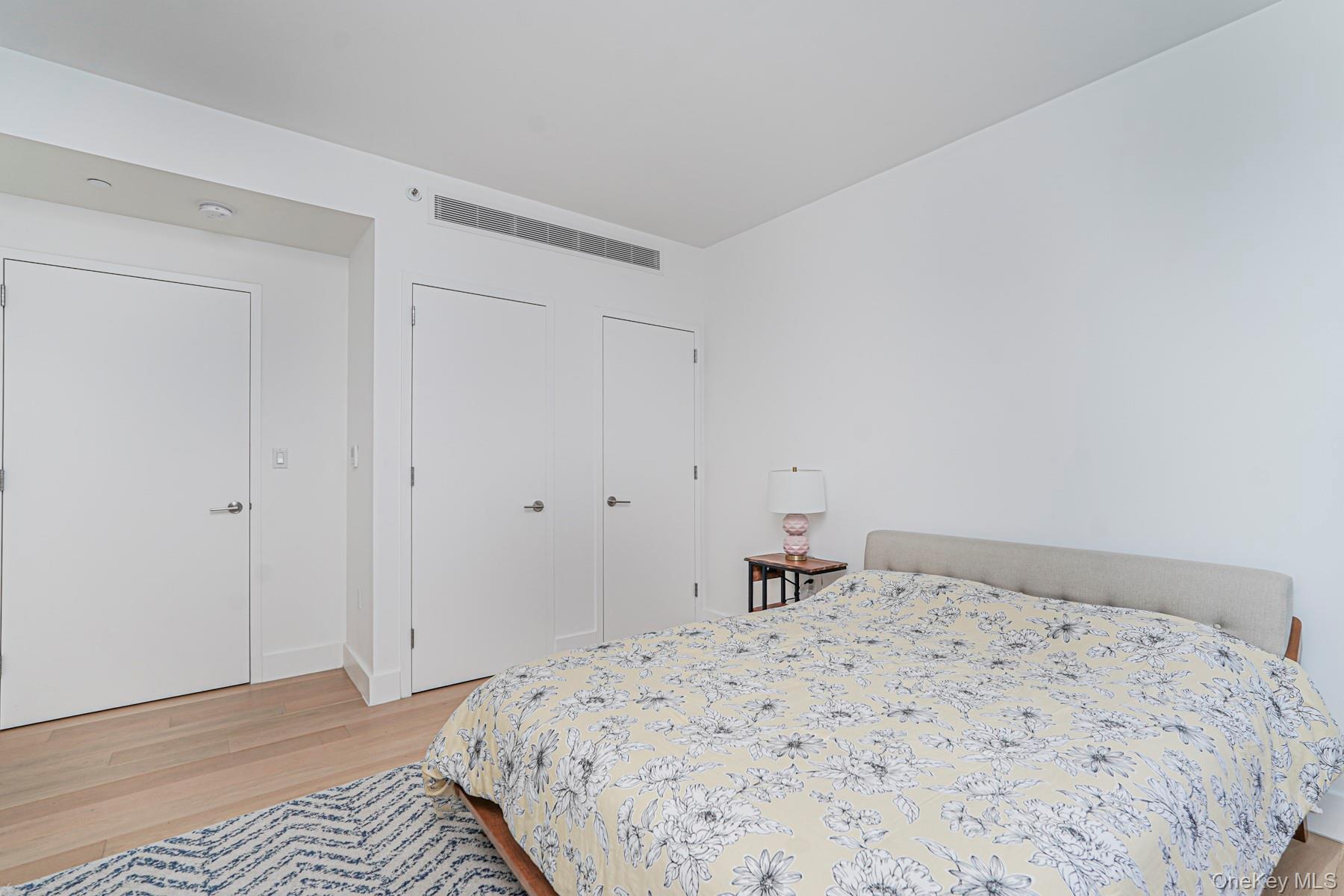 133 Beach 116th Street, Unit 2C Queens, NY 11694 - Photo 20 of 35 a bedroom with a bed and a window