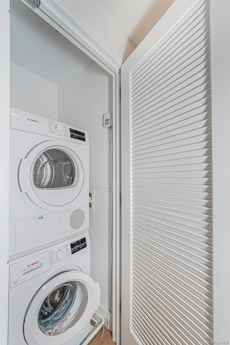 133 Beach 116th Street, Unit 2C Queens, NY 11694 - Photo 22 of 35 a utility room with dryer and washer