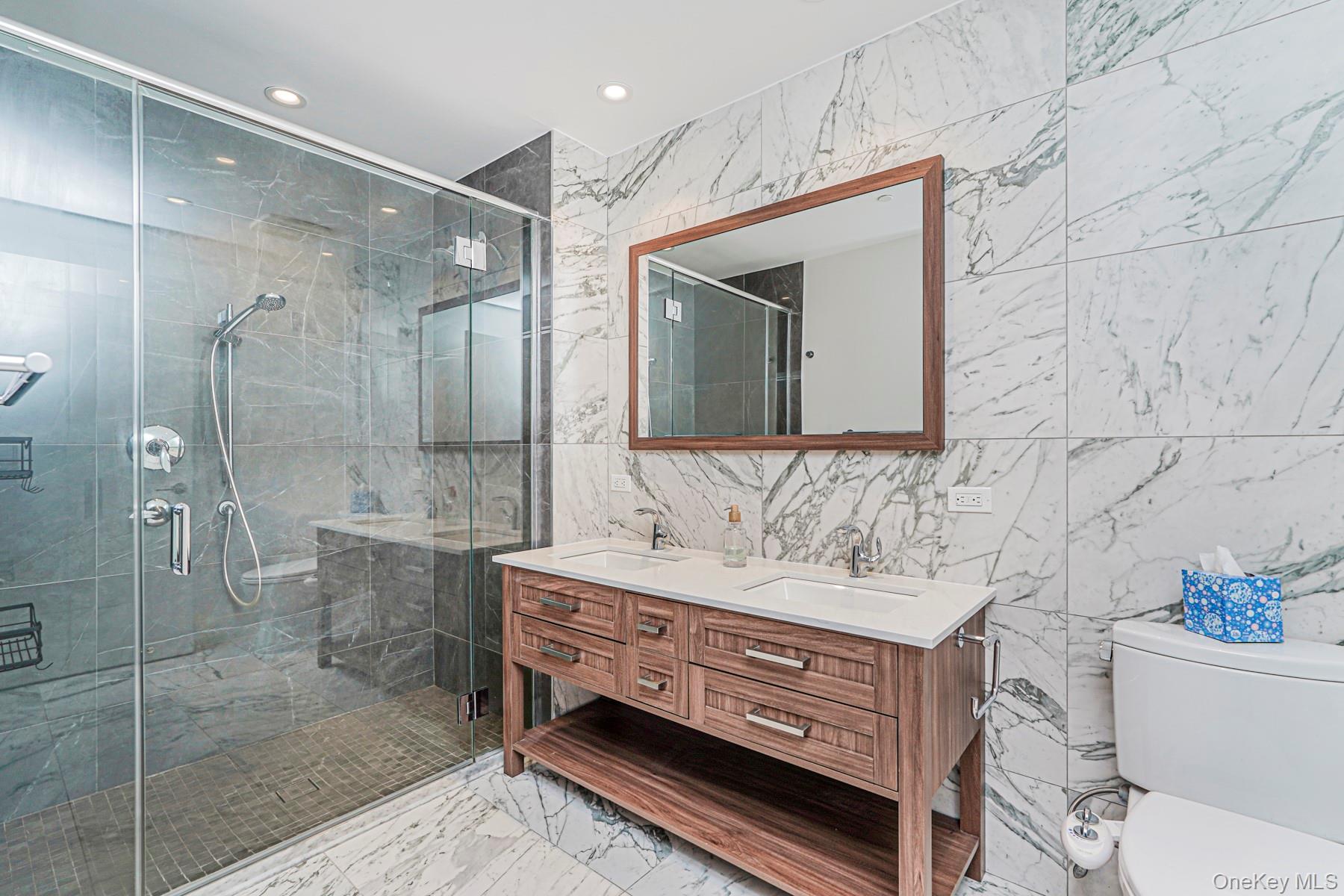 133 Beach 116th Street, Unit 2C Queens, NY 11694 - Photo 27 of 35 a bathroom with a sink toilet and shower