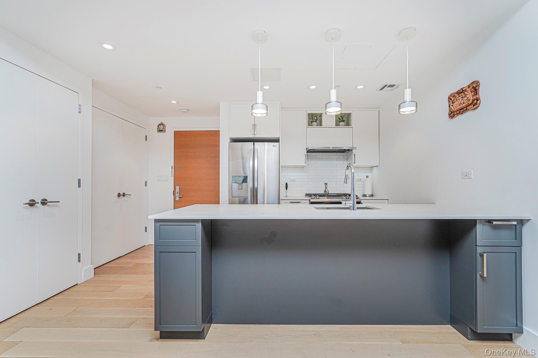 133 Beach 116th Street, Unit 2C Queens, NY 11694 - Photo 6 of 35 a bathroom with a sink and a mirror
