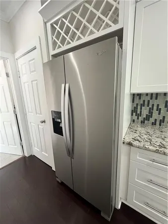 a view of a storage and utility room with a washer dryer