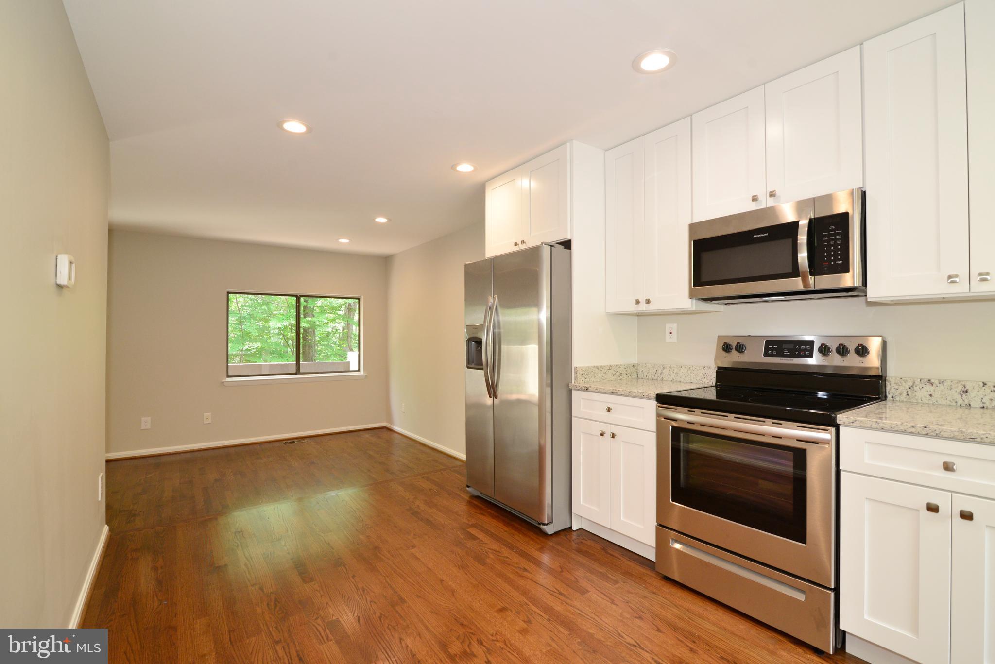 11803 Coopers Court Reston, VA 20191 - Photo 4 of 38 KITCHEN IS OPEN TO FAMILY ROOM