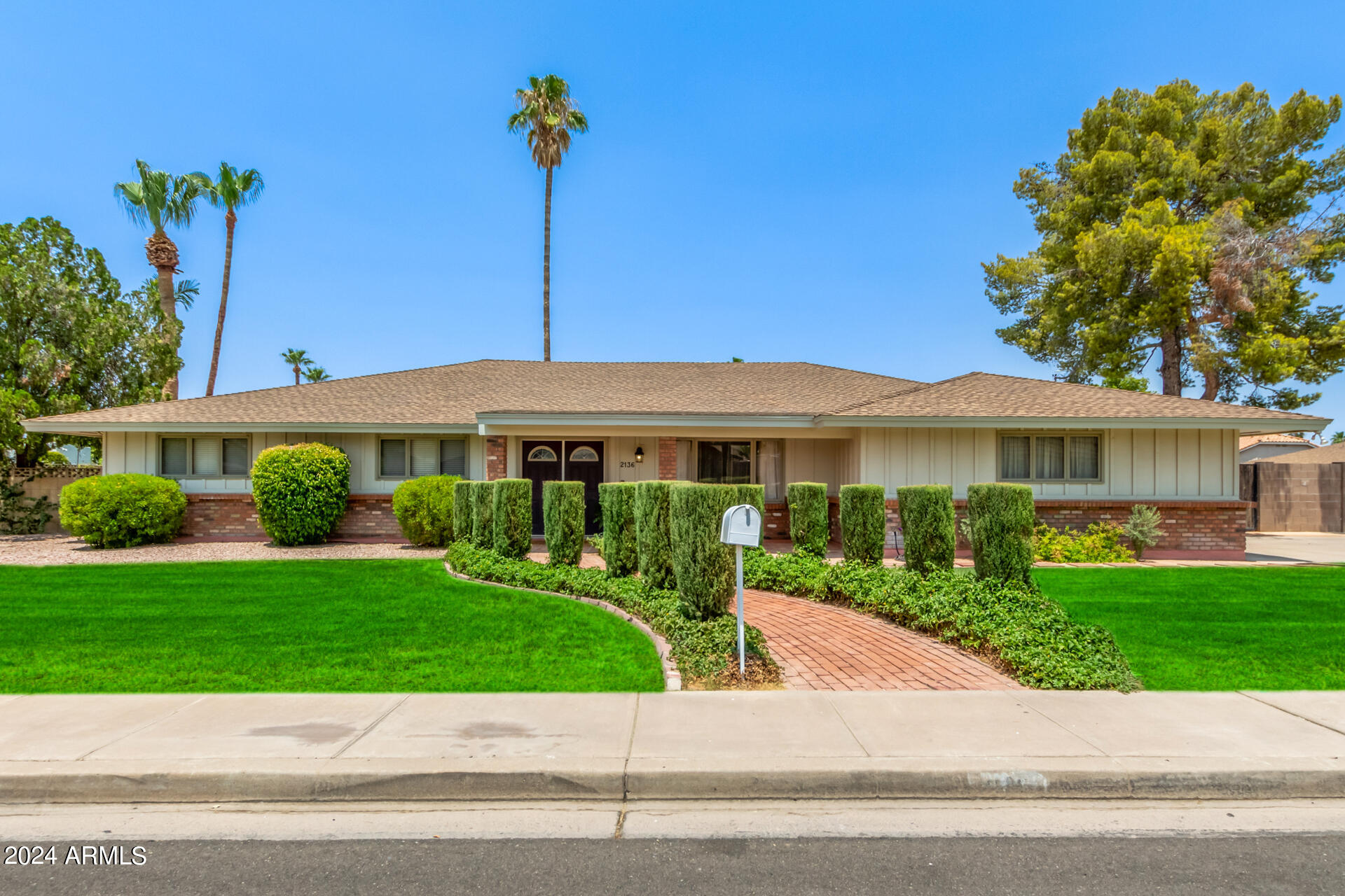 2136 East Inca Street Mesa, AZ 85213 - Photo 1 of 1 a front view of a house with a yard and potted plants