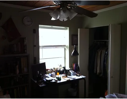 a kitchen with a refrigerator and a table