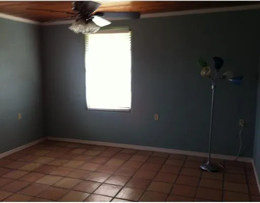 a bathroom with a sink a toilet a window and tub