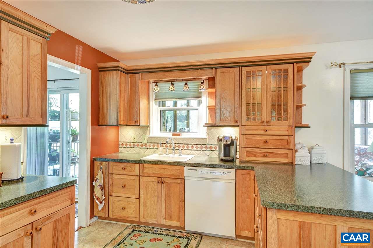 2974 Courthouse Road Louisa, VA 23093 - Photo 12 of 49 a kitchen with stainless steel appliances granite countertop a sink a stove and cabinets