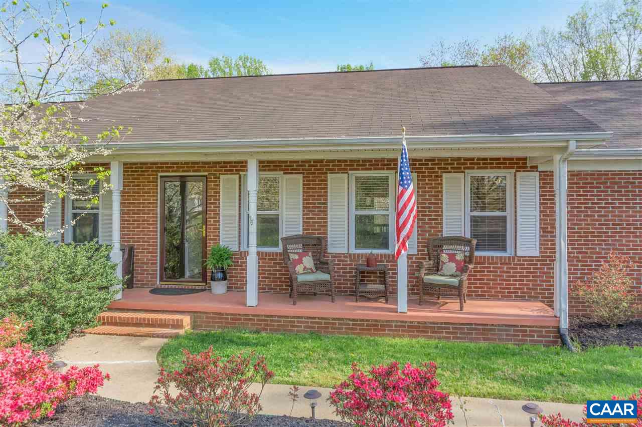 2974 Courthouse Road Louisa, VA 23093 - Photo 2 of 49 a view of a house with backyard sitting area and garden