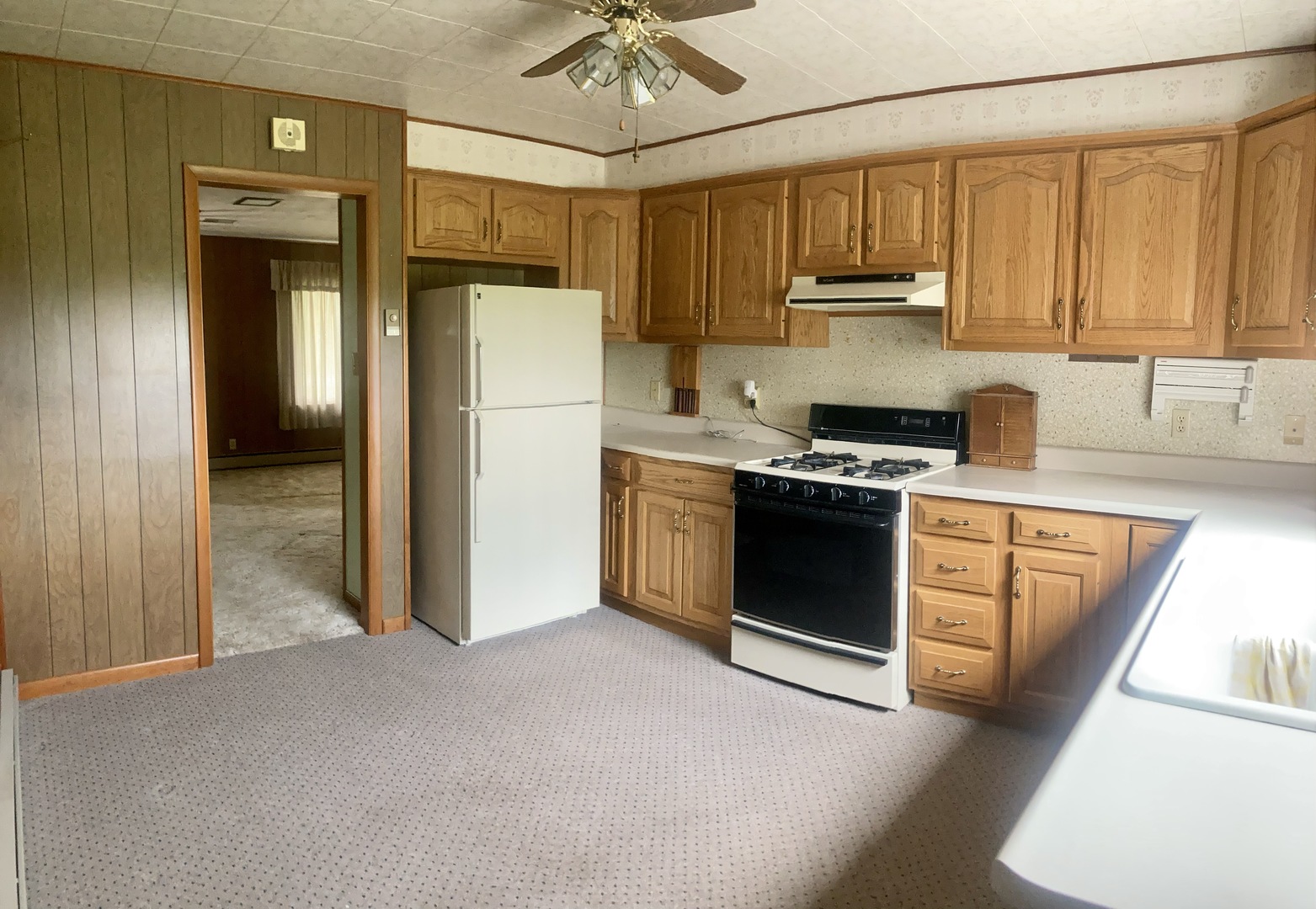 581 Penrose Road Dixon, IL 61021 - Photo 3 of 29 a kitchen with stainless steel appliances granite countertop a stove a refrigerator and a sink with granite countertops