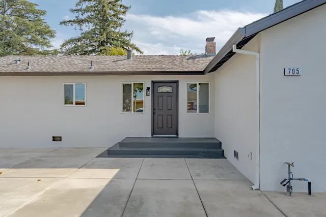 a front view of a house with a porch