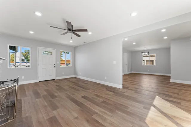 wooden floor in an empty room with a window
