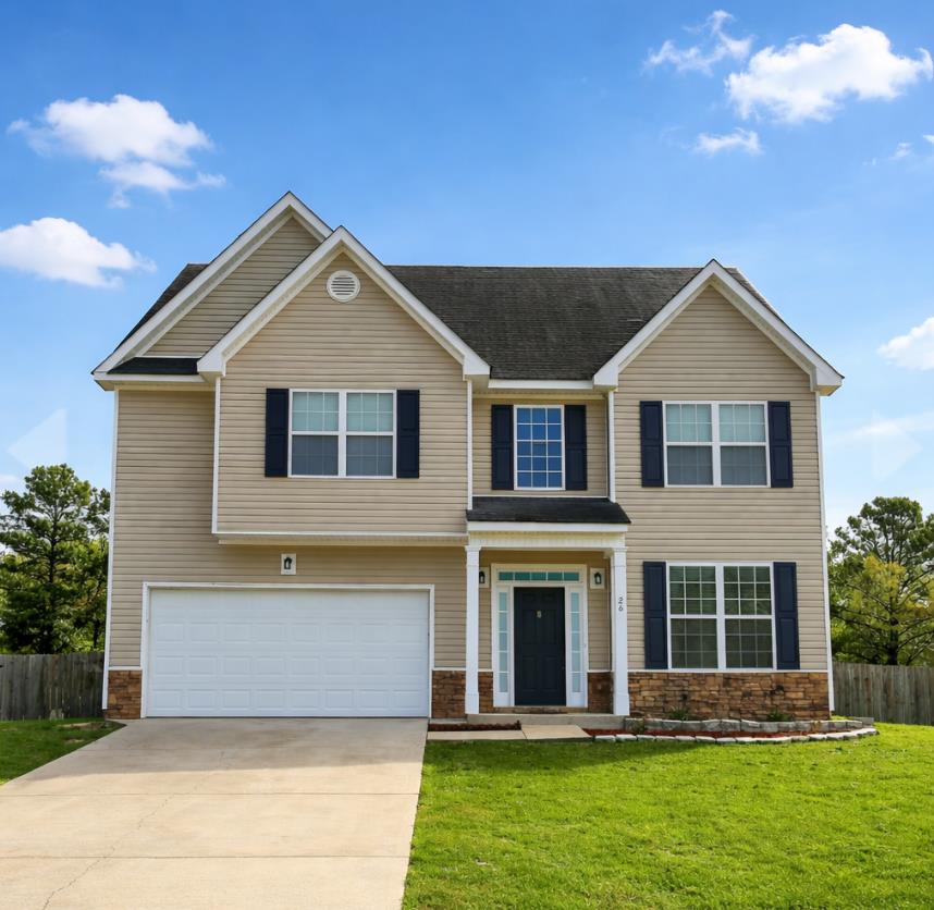 a front view of a house with a yard