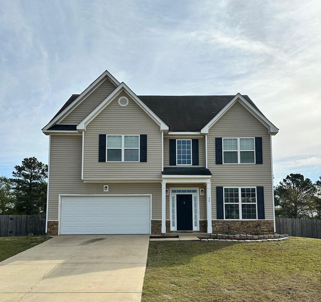 a front view of a house with windows yard and swimming pool