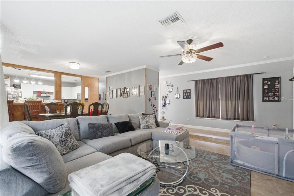 4464 Bromley Avenue Spring Hill, FL 34609 - Photo 14 of 43 a living room with furniture and a large window