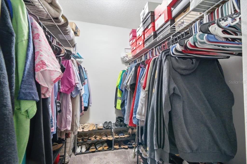 4464 Bromley Avenue Spring Hill, FL 34609 - Photo 31 of 43 a view of walk in closet with clothes