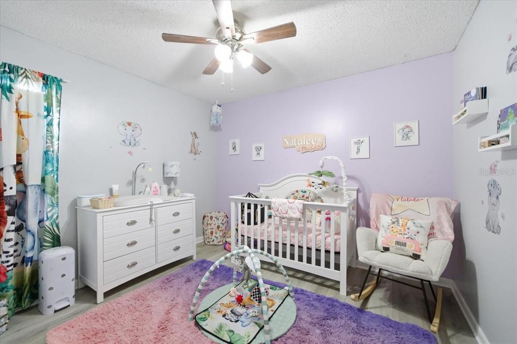 4464 Bromley Avenue Spring Hill, FL 34609 - Photo 32 of 43 a bedroom with furniture and a window