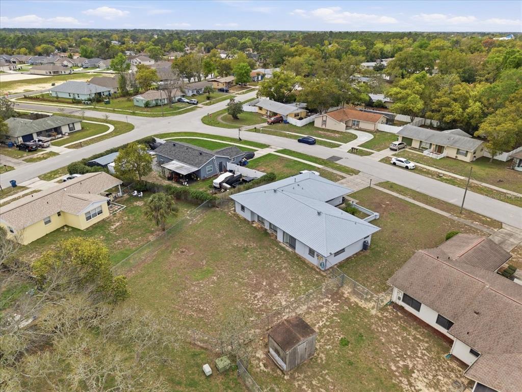 4464 Bromley Avenue Spring Hill, FL 34609 - Photo 38 of 43 an aerial view of residential houses with outdoor space