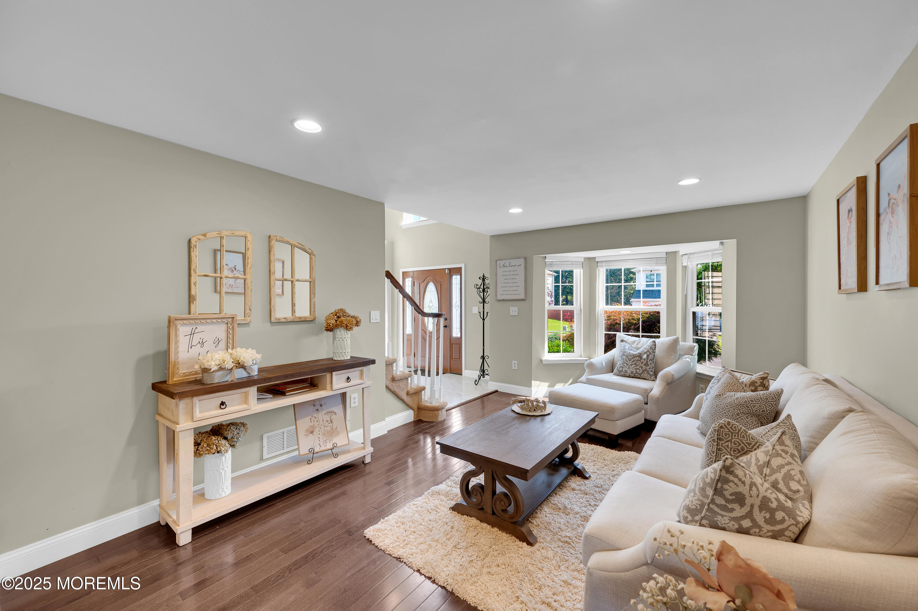 4 Diamond Lane Howell, NJ 07731 - Photo 11 of 63 a living room with furniture and a wooden floor