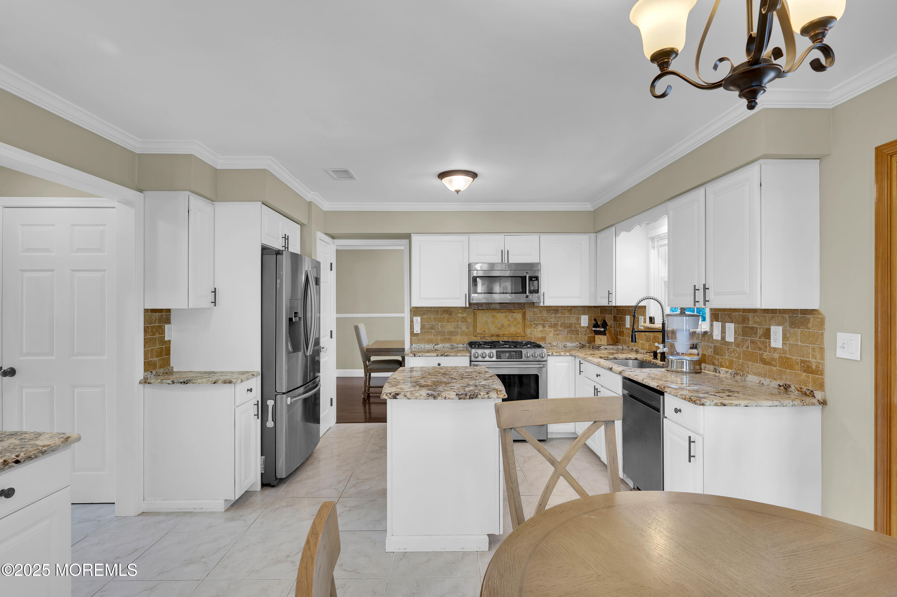 4 Diamond Lane Howell, NJ 07731 - Photo 14 of 63 a kitchen with refrigerator a stove and cabinets