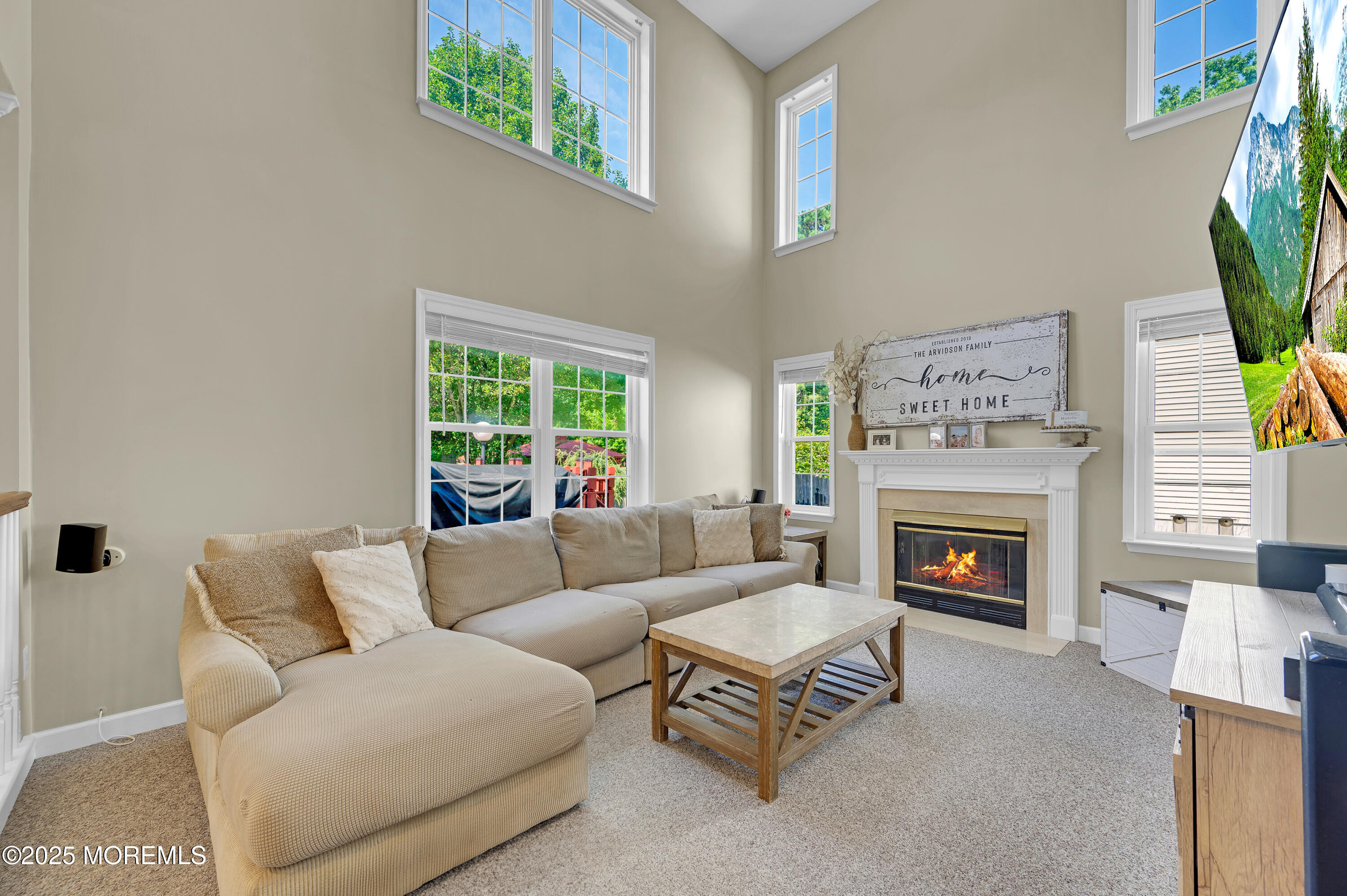 4 Diamond Lane Howell, NJ 07731 - Photo 24 of 63 a living room with furniture and a fireplace