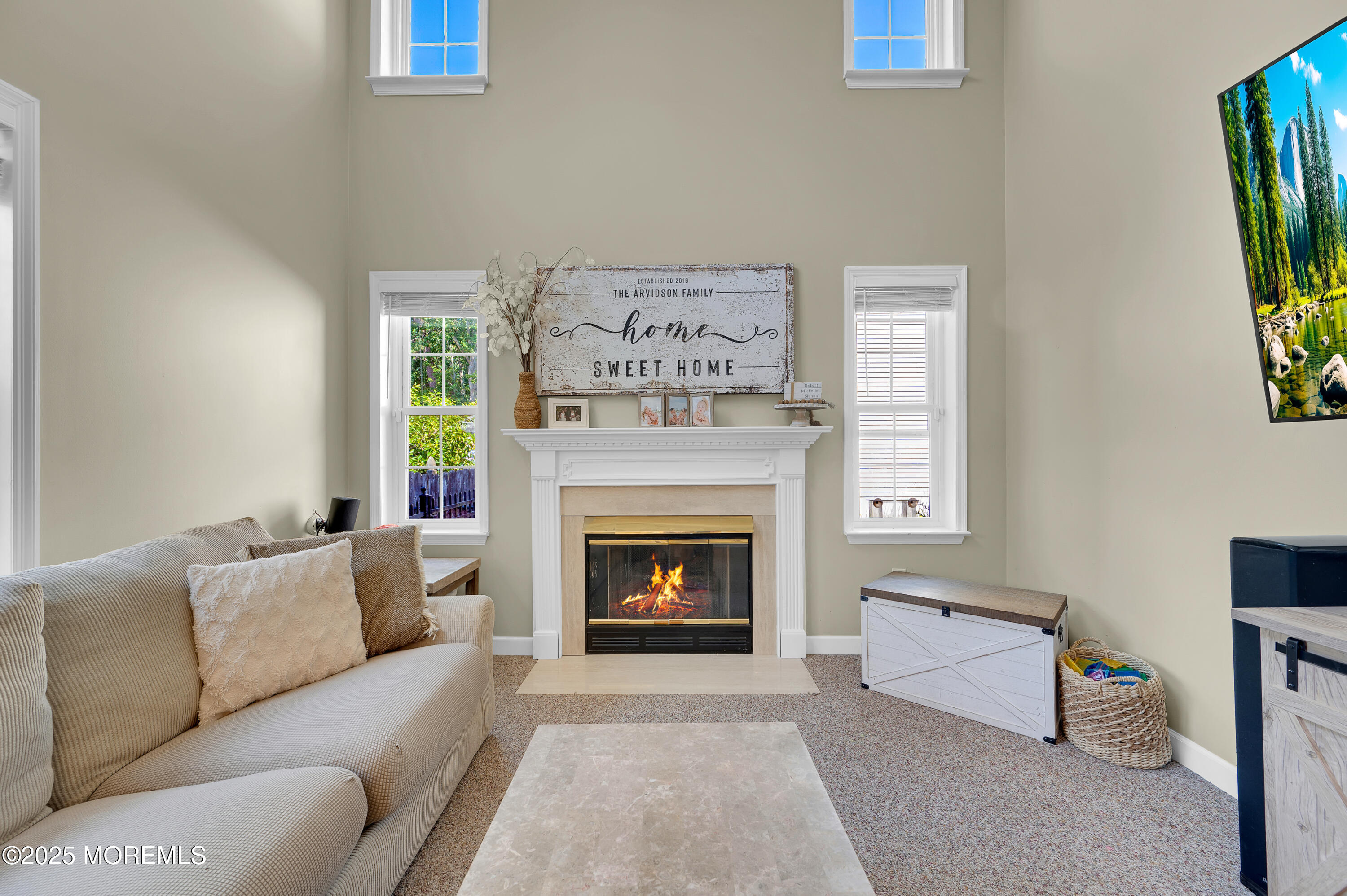 4 Diamond Lane Howell, NJ 07731 - Photo 27 of 63 a living room with furniture and a fireplace