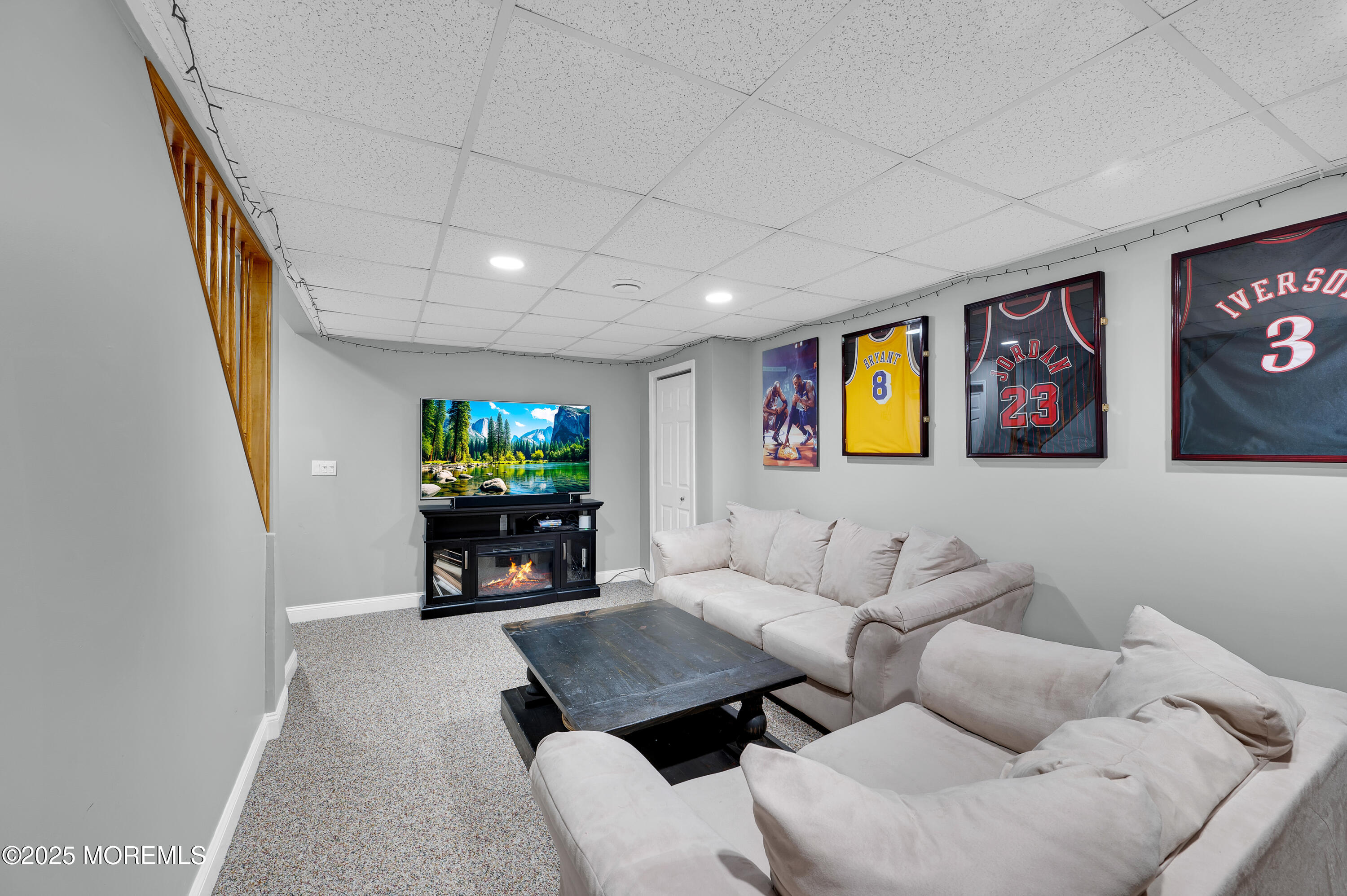4 Diamond Lane Howell, NJ 07731 - Photo 39 of 63 a living room with furniture and a flat screen tv
