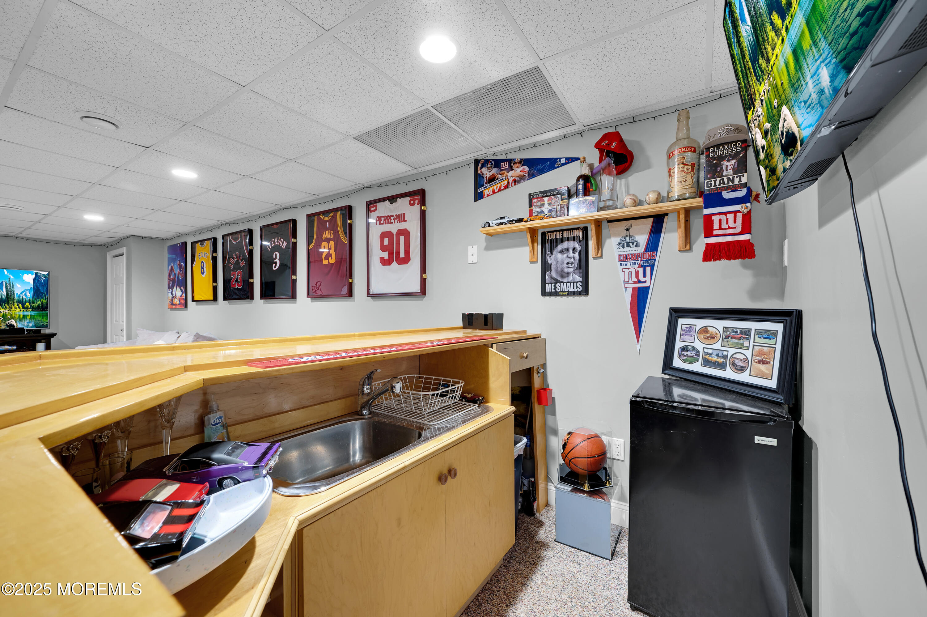 4 Diamond Lane Howell, NJ 07731 - Photo 42 of 63 a living room with furniture and a flat screen tv