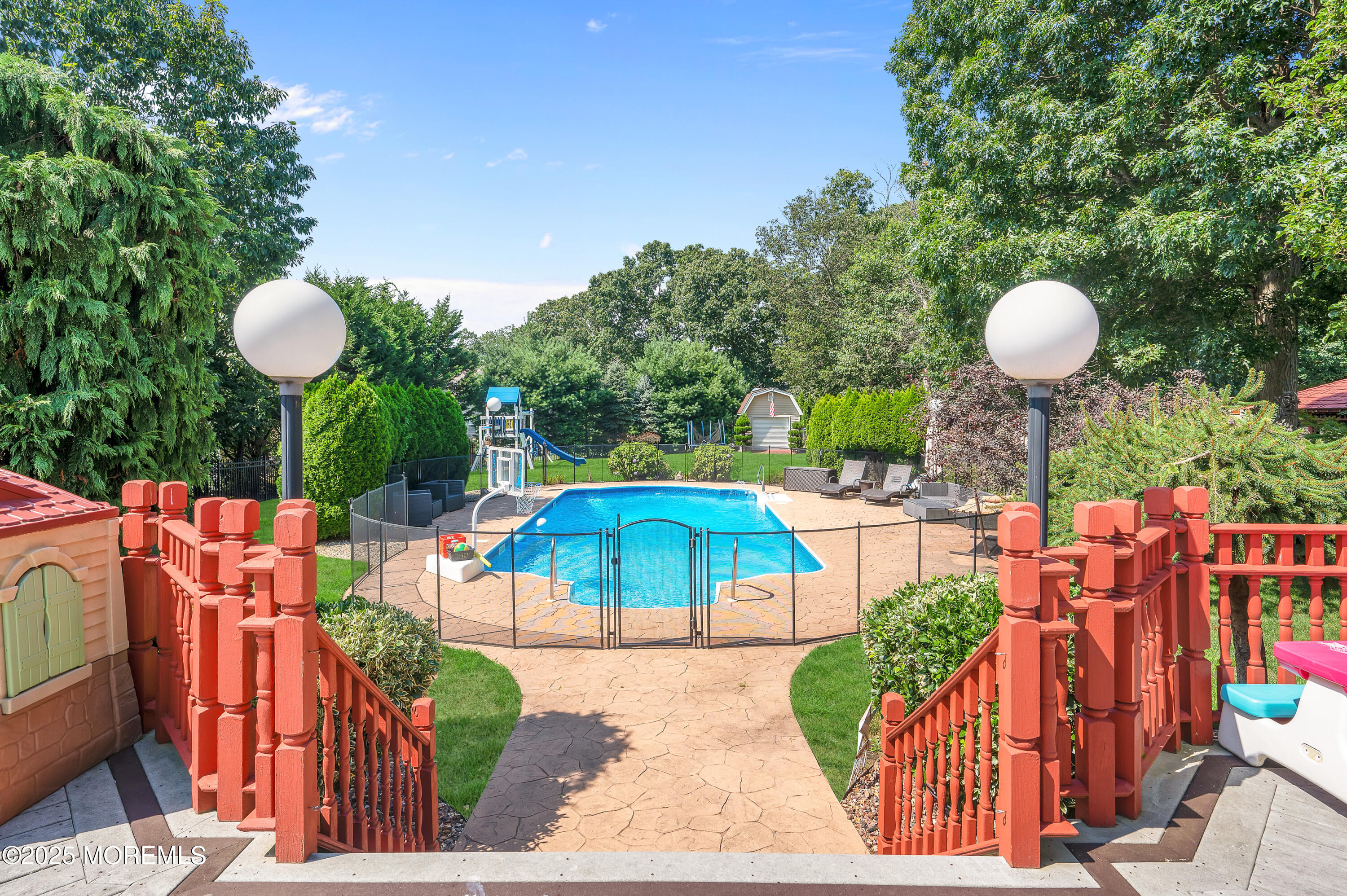 4 Diamond Lane Howell, NJ 07731 - Photo 48 of 63 a view of a swimming pool with a patio and a garden